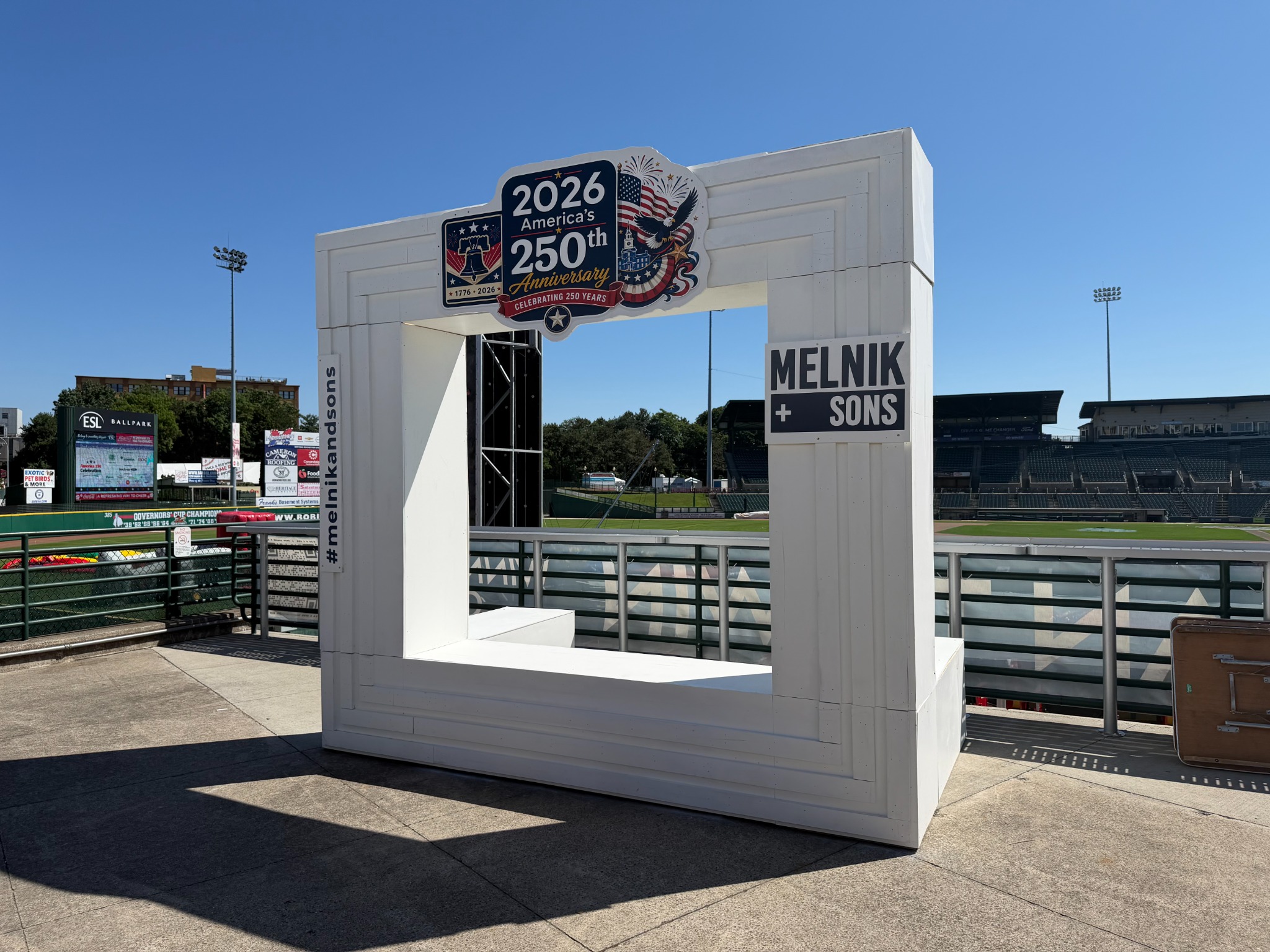Everest photo landmark at a previous ballpark installation, with America's 250th and sponsor signage.