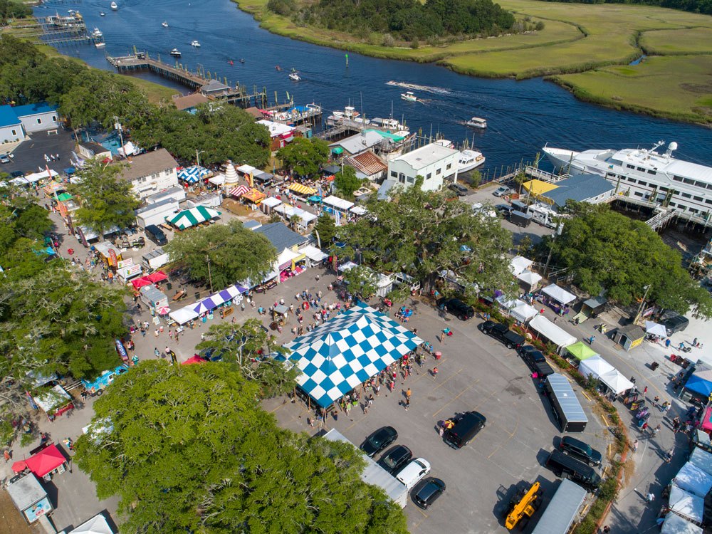 A real outdoor event with crowds and vendor tents